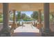 Resort-style pool area framed by stately columns and desert landscaping; perfect for relaxing and entertaining outdoors at 19550 N Grayhawk Dr # 1039, Scottsdale, AZ 85255