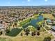 Panoramic aerial view of a community featuring a golf course, lake, and beautiful homes at 19920 N 69Th Ave, Glendale, AZ 85308