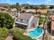 Aerial view showcasing a pool and patio with a balcony in a neighborhood with mountain views at 19920 N 69Th Ave, Glendale, AZ 85308