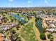 Expansive aerial view of the golf course and lake in a vibrant community at 19920 N 69Th Ave, Glendale, AZ 85308