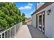 View from the balcony surrounded by lush green trees and a clear blue sky at 19920 N 69Th Ave, Glendale, AZ 85308