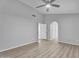 Bedroom with wood floors and an open archway leading to another room at 19920 N 69Th Ave, Glendale, AZ 85308