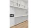 Large closet with shelves, rack for hanging clothes, and a safe at 19920 N 69Th Ave, Glendale, AZ 85308