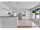 Bright kitchen featuring white cabinets, stainless steel appliances, granite counters, and tiled floor at 19920 N 69Th Ave, Glendale, AZ 85308