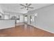 Open concept living space with kitchen view, stainless appliances, and outdoor access at 19920 N 69Th Ave, Glendale, AZ 85308