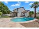 Beautiful backyard pool with a tanning ledge, surrounded by a patio, with the house and balcony in the background at 19920 N 69Th Ave, Glendale, AZ 85308