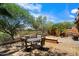 Landscaped backyard with desert landscaping, dining set, barbecue grill and privacy fence provides a private retreat at 20750 N 87Th St # 1024, Scottsdale, AZ 85255