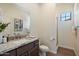 Well-lit bathroom with a vanity, sink, mirror, and shower at 20750 N 87Th St # 1024, Scottsdale, AZ 85255
