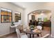 Bright dining area showcases stylish table setting and flows into the kitchen area at 20750 N 87Th St # 1024, Scottsdale, AZ 85255