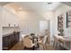Bright dining area features a modern table setting, cabinetry, and a convenient workspace at 20750 N 87Th St # 1024, Scottsdale, AZ 85255
