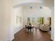 Bright dining room with high ceilings and large windows, leading to the living room at 20750 N 87Th St # 1024, Scottsdale, AZ 85255