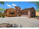 Charming stone and stucco home with a two-car garage and well-manicured landscaping at 20750 N 87Th St # 1024, Scottsdale, AZ 85255
