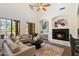 Bright living room with fireplace and large windows at 20750 N 87Th St # 1024, Scottsdale, AZ 85255