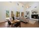 Open-concept living room with fireplace and adjacent dining area at 20750 N 87Th St # 1024, Scottsdale, AZ 85255
