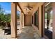 Covered patio with flagstone flooring, ceiling fans, and an outdoor kitchen provides an ideal space for entertaining at 20750 N 87Th St # 1024, Scottsdale, AZ 85255