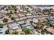 An aerial view showcases solar panels, a backyard pool, and desert landscaping in a peaceful residential neighborhood setting at 2139 W Obispo Ave, Mesa, AZ 85202