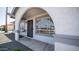 Close up of the front of this home featuring a gated security door and an arched doorway at 2139 W Obispo Ave, Mesa, AZ 85202