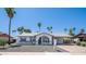 Charming single-story home featuring desert landscaping, neutral paint, and a covered carport at 2139 W Obispo Ave, Mesa, AZ 85202