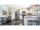 Bright kitchen featuring stainless steel appliances, white cabinetry, stone countertops, and modern design at 2139 W Obispo Ave, Mesa, AZ 85202