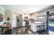 Charming kitchen with stainless appliances, white cabinetry, and open access to backyard at 2139 W Obispo Ave, Mesa, AZ 85202