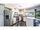 Updated kitchen featuring white cabinets, stainless steel appliances, and sleek countertops at 2139 W Obispo Ave, Mesa, AZ 85202
