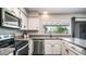 Bright, recently remodeled kitchen featuring stainless steel appliances, window with backyard views at 2139 W Obispo Ave, Mesa, AZ 85202