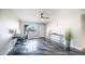 Open living room with lots of light featuring epoxy floors and access to front door at 2139 W Obispo Ave, Mesa, AZ 85202