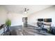 Open living room featuring striking dark epoxy floors and neutral paint at 2139 W Obispo Ave, Mesa, AZ 85202