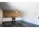 Bright living room with wood accent wall, fireplace, built-in cabinets, ceiling fan and sleek epoxy flooring at 2139 W Obispo Ave, Mesa, AZ 85202