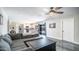 Open-concept living room and kitchen featuring recessed lights and easy access to outdoor patio at 2139 W Obispo Ave, Mesa, AZ 85202