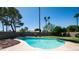 Inviting pool surrounded by lush green lawn and mature palm trees, perfect for outdoor relaxation at 2139 W Obispo Ave, Mesa, AZ 85202