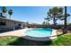 Inviting pool with sun shade and nearby outdoor seating, set in a lush backyard oasis at 2139 W Obispo Ave, Mesa, AZ 85202