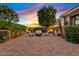 Private backyard patio with pavers, comfortable seating and professional landscaping at 21912 E Desert Hills Dr, Queen Creek, AZ 85142