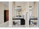 Bathroom vanity area with dual mirrors and a stool at 21912 E Desert Hills Dr, Queen Creek, AZ 85142