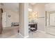 Vanity area in bathroom features a seating area, cabinets, and decorative mirror at 21912 E Desert Hills Dr, Queen Creek, AZ 85142