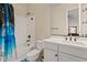 Bright bathroom with a shower-tub combo and a white vanity with dual sinks at 21912 E Desert Hills Dr, Queen Creek, AZ 85142