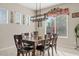 Cozy dining room featuring a dining table with seating for six and natural light at 21912 E Desert Hills Dr, Queen Creek, AZ 85142
