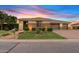 Charming home featuring well-maintained landscaping and a three-car garage at 21912 E Desert Hills Dr, Queen Creek, AZ 85142