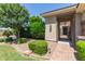 Home with an inviting front entrance with a brick walkway and mature landscaping at 21912 E Desert Hills Dr, Queen Creek, AZ 85142