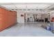 Spacious garage interior with built-in cabinets, storage, and ample room for vehicles at 21912 E Desert Hills Dr, Queen Creek, AZ 85142