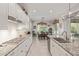 Bright kitchen showcases granite counters, gas range, and an adjacent dining area at 21912 E Desert Hills Dr, Queen Creek, AZ 85142