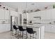 Bright kitchen with a granite island, stainless steel appliances, and a walk-in pantry at 21912 E Desert Hills Dr, Queen Creek, AZ 85142