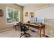 Bright office with natural light, a large desk, and views of the backyard at 21912 E Desert Hills Dr, Queen Creek, AZ 85142