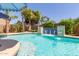 Beautiful pool with waterfall feature, lush landscaping, and inviting atmosphere at 21912 E Desert Hills Dr, Queen Creek, AZ 85142