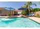 Relaxing pool area with lounge chairs, shade umbrellas, and comfortable patio seating at 21912 E Desert Hills Dr, Queen Creek, AZ 85142