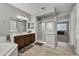 Well-lit bathroom has a tub, double vanity, and a separate glass-enclosed shower at 22870 E Sonoqui Blvd, Queen Creek, AZ 85142