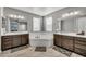 Bathroom with a soaking tub and dual vanities provides relaxation and convenience at 22870 E Sonoqui Blvd, Queen Creek, AZ 85142