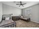 Bedroom with two twin beds, ceiling fan, and carpeted floors offers great space at 22870 E Sonoqui Blvd, Queen Creek, AZ 85142