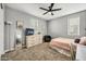 Bright bedroom featuring carpeted floors, ceiling fan, and a comfortable bed with coordinated decor at 22870 E Sonoqui Blvd, Queen Creek, AZ 85142