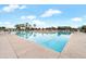 Enjoy this community pool with plenty of seating surrounded by landscaped greenery and palm trees at 22870 E Sonoqui Blvd, Queen Creek, AZ 85142